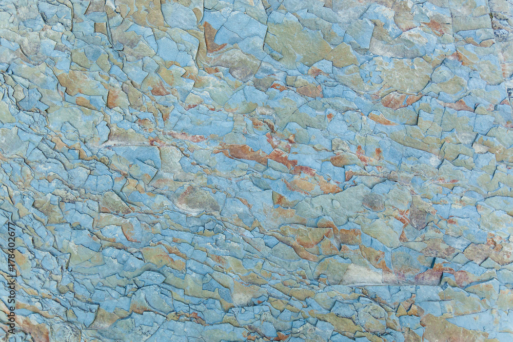 the texture of the stone is blue with red spots
