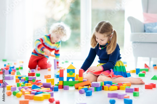 Kids play with toy blocks. Toys for children.