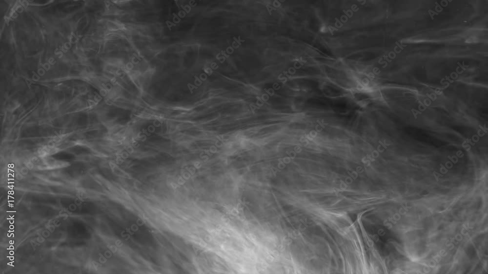 white smoke is slowly spinning on a black background white smoke is slowly spinning on a black background