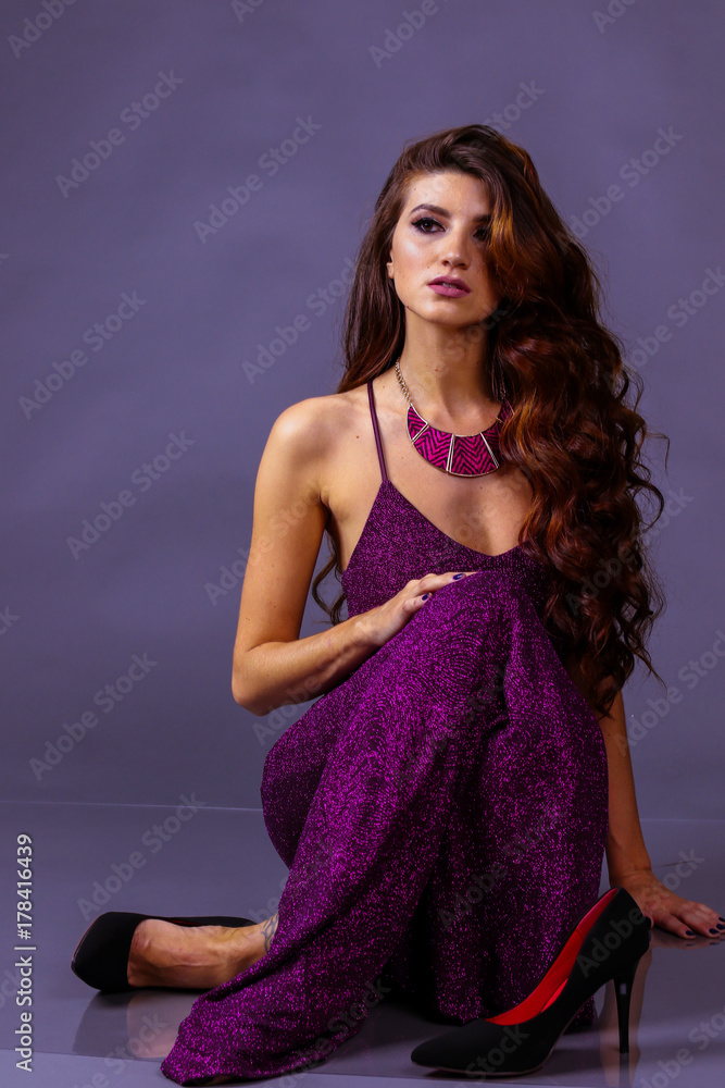 Obraz premium beautiful girl with long hair in purple dress