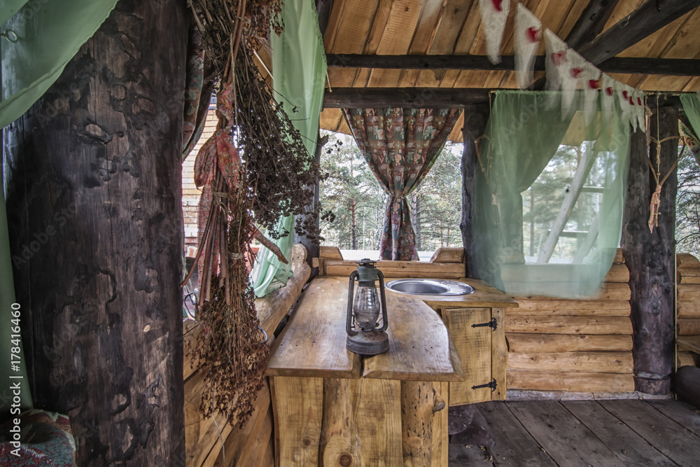 Rural kitchen in wooden gazebo