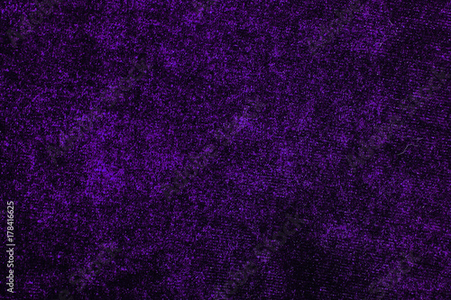 Purple Velvet dress fabrics material cloth texture pattern. tailoring stitching concept. Shiny beautiful fashion fabric. Shiny clothing material sample.Creased fabric.