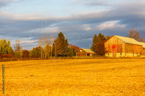Old weathered barn in Wisconsin with colorful autumn trees