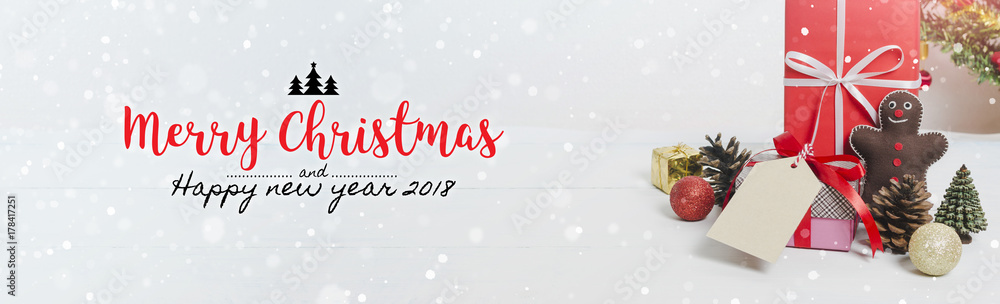 Christmas and New Year holidays gift box with decorative ornament on white wooden table with falling snow effect banner.Merry Christmas & Happy New Year 2018.Gifts and congratulations concept. - obrazy, fototapety, plakaty 