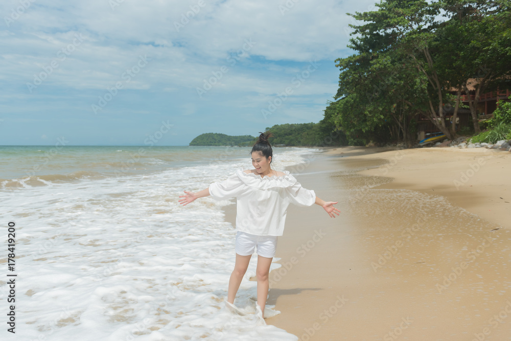 Portrait of beautiful asian, sea landscape background, slim tanned body, travel alone, freedom woman on summer vacation in KOH JUM, KRABI,THAILAND, relaxing on tropical beach. Portrait of beautiful asian, sea landscape background, slim tanned body, travel alone, freedom woman on summer vacation in KOH JUM, KRABI,THAILAND, relaxing on tropical beach.