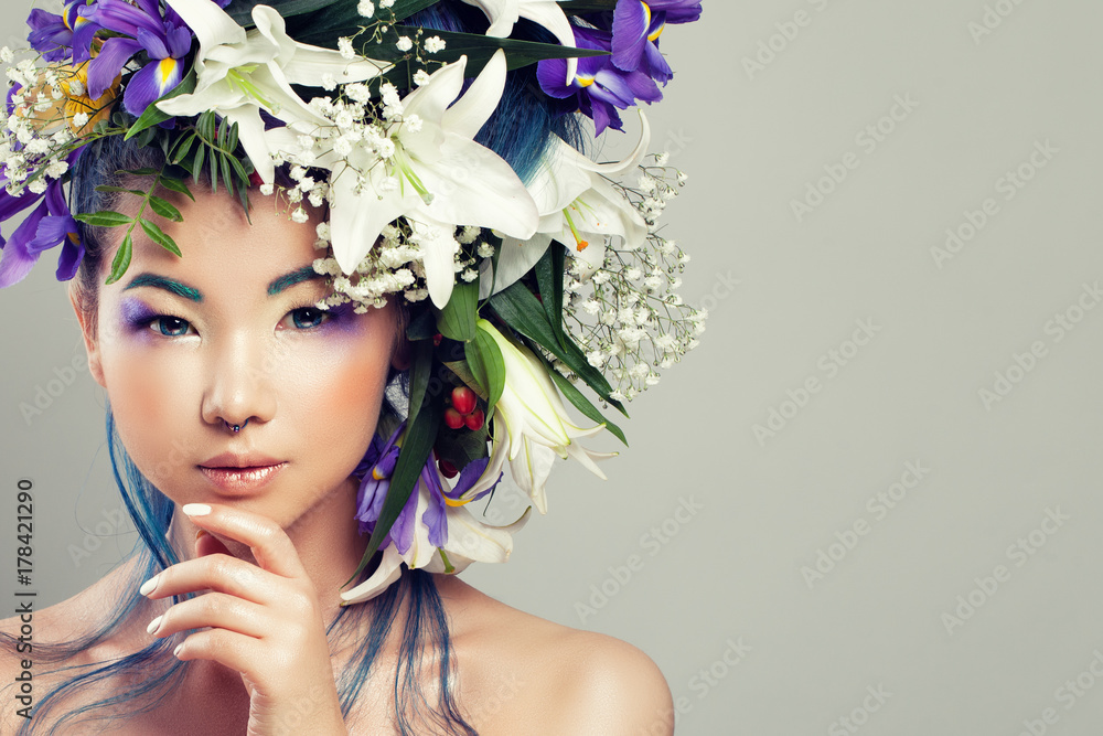 Perfect Asian Model Woman with Vivid Flowers and Fashion Makeup. Summer Fashion Girl with White Lily and Iris Flowers