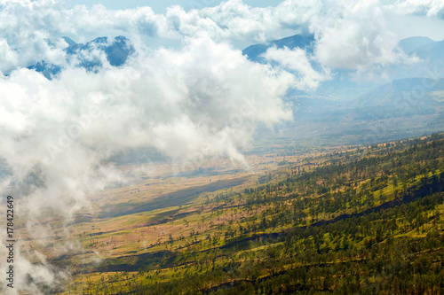 Mountain landscape in the clouds. View from above. Trekking on the volcano of Rinjani. Indonesia. © delbars