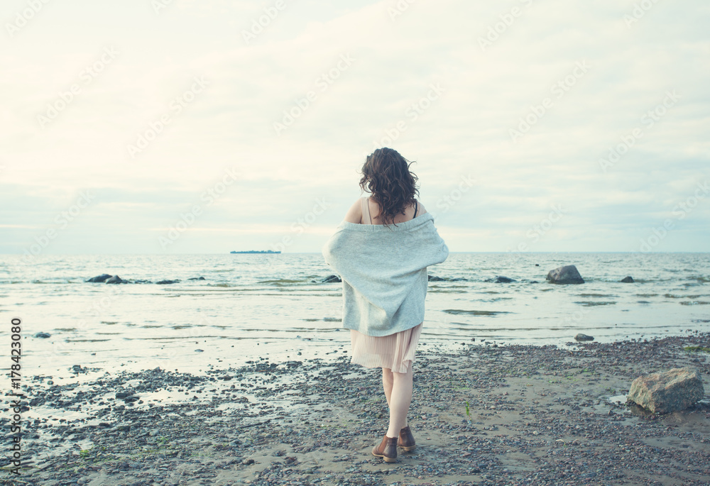 Healthy Woman Resting on Blue Sea and Sky Background Outdoors