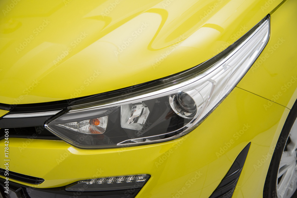 Headlight of yellow CAR Close up. Exterior Detail