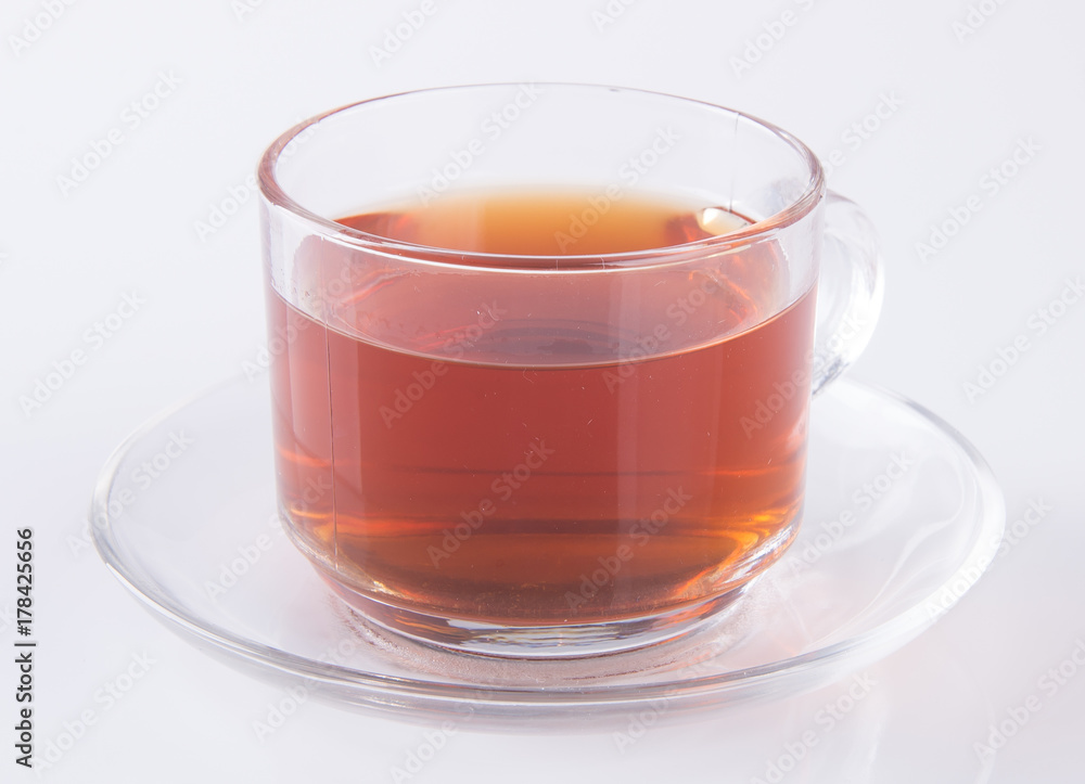 Tea in glass cup or glass cup of black tea on a background. Tea in glass cup or glass cup of black tea on a background.