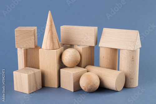wooden geometric shapes on a blue photo