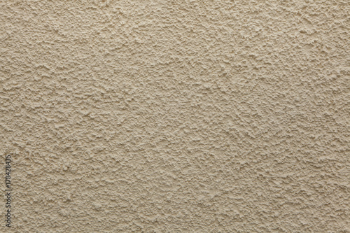 Beige painted stucco wall. Background texture.