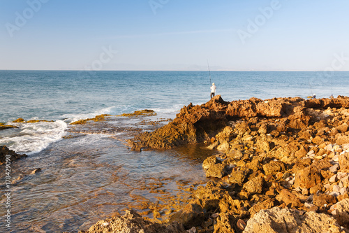 Wallpaper Mural Fisherman is fishing at My Hiep beach in early morning, Ninh Thuan, Vietnam. Ninh Thuan is famous for beautiful landscapes, majestic Cham towers and unique Cham culture. Torontodigital.ca