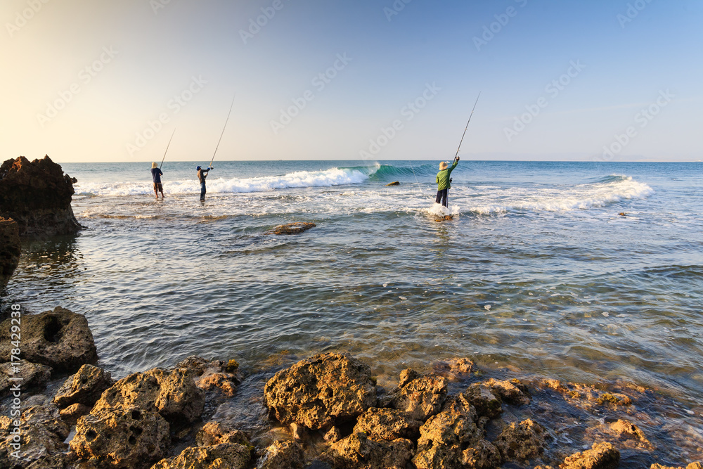 Fisherman is fishing at My Hiep beach in early morning, Ninh Thuan, Vietnam. Ninh Thuan is famous for beautiful landscapes, majestic Cham towers and unique Cham culture. Fisherman is fishing at My Hiep beach in early morning, Ninh Thuan, Vietnam. Ninh Thuan is famous for beautiful landscapes, majestic Cham towers and unique Cham culture.