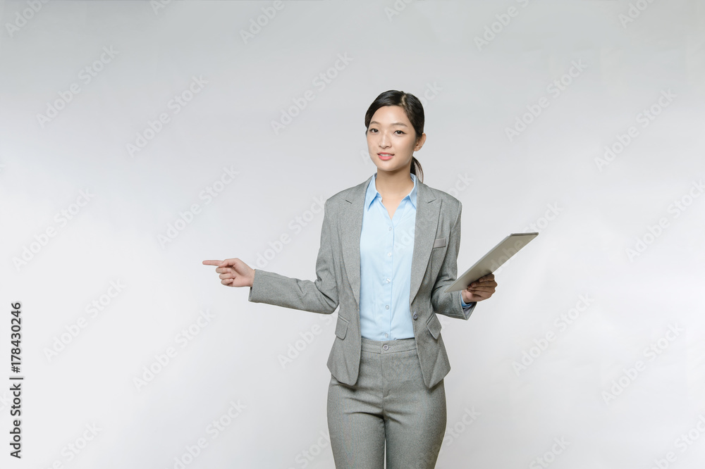 Asian Woman hold with tablet pc and open hand palm