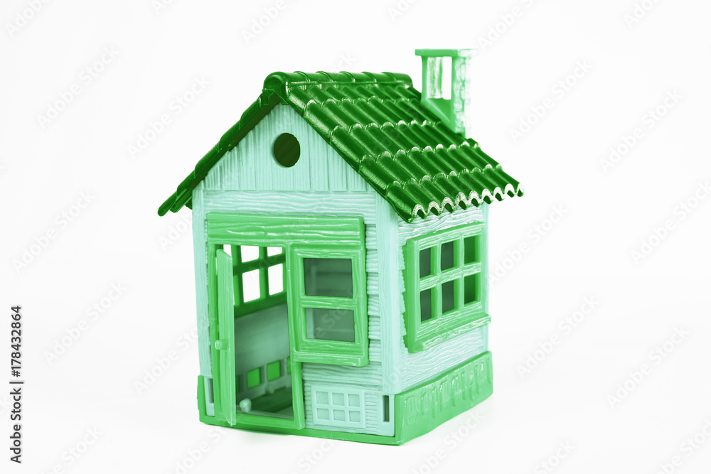 Green toy house on white background. Studio photo. Cute mini house. Green toy house on white background. Studio photo. Cute mini house.