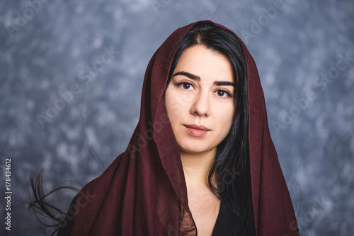 portrait of Arab women with long hair in a scarf