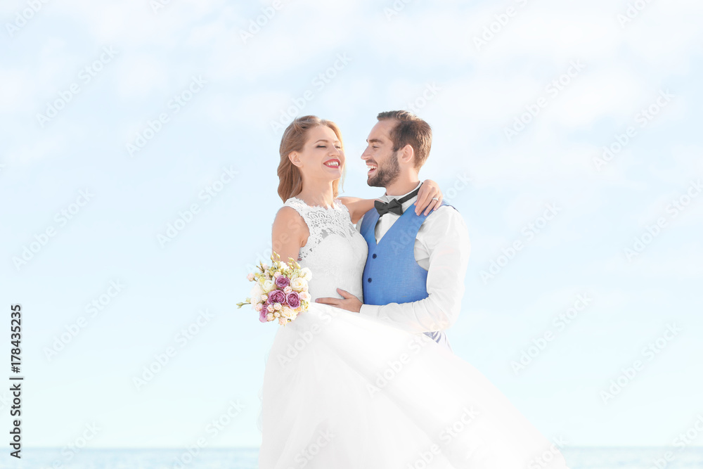Happy wedding couple on sea beach Happy wedding couple on sea beach