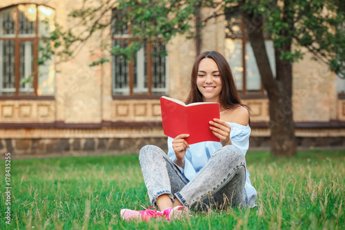 Young female student readin...