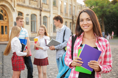 Young female student with f...