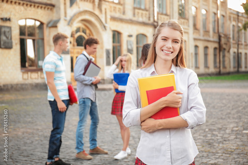 Young female student with f...