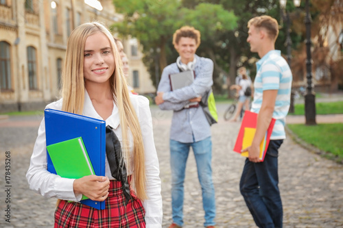 Young female student with f...