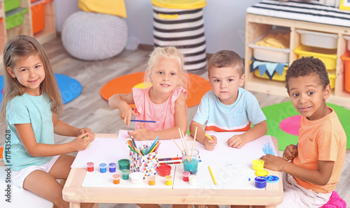 Cute children painting at t...