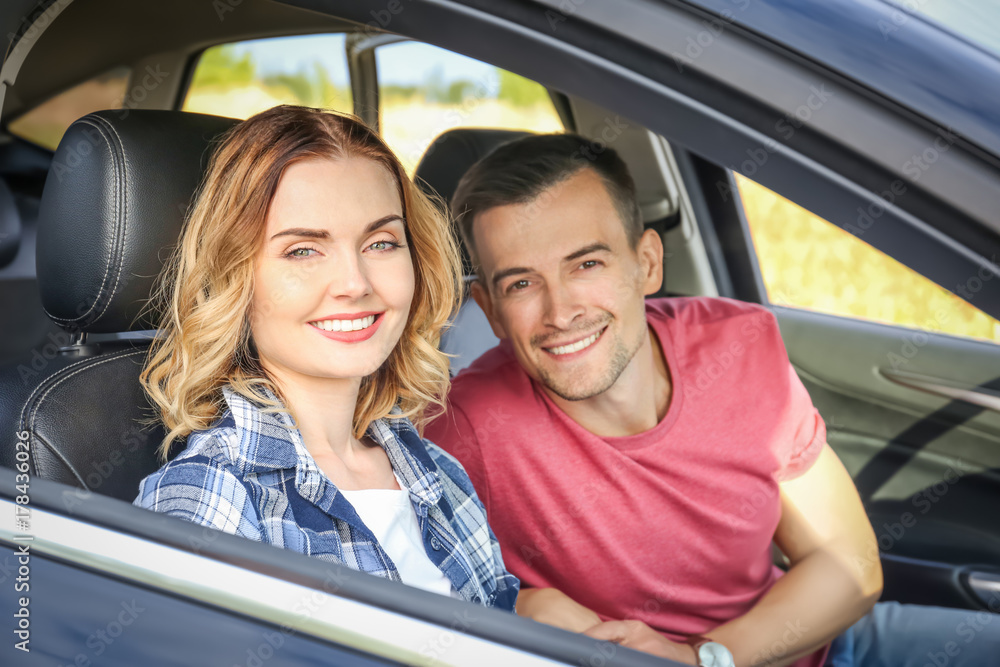 Beautiful young couple in car Beautiful young couple in car