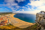 Scenic aerial view of seascape and beach waterfront from popular Miradouro do Suberco viewpoint in Nazare Sitio, the upper part of the city above the giant cliffs in Central Portugal, Europe.