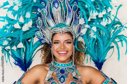 Cheerful samba dancer portrait wearing blue traditional costume