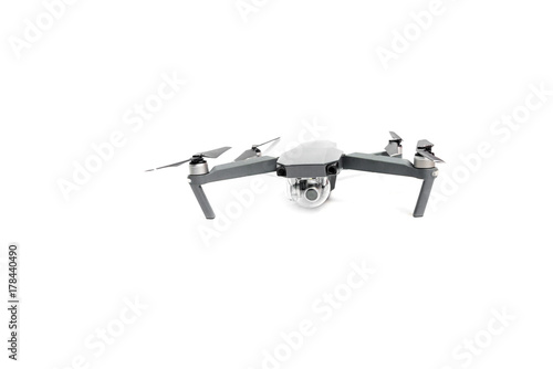 Flying helicopter drone with camera. Studio shot isolated on white background.
