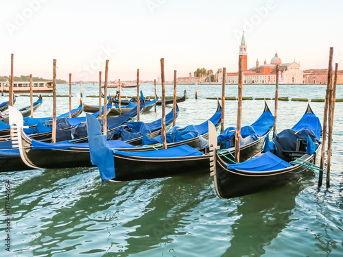 Gondolas moored in the Venetian lagoon