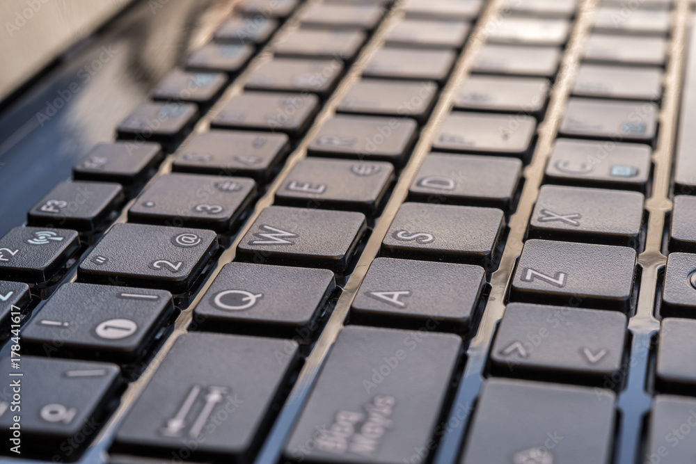 Close-up electronic of laptop keyboard with focus on button, copy space Close-up electronic of laptop keyboard with focus on button, copy space