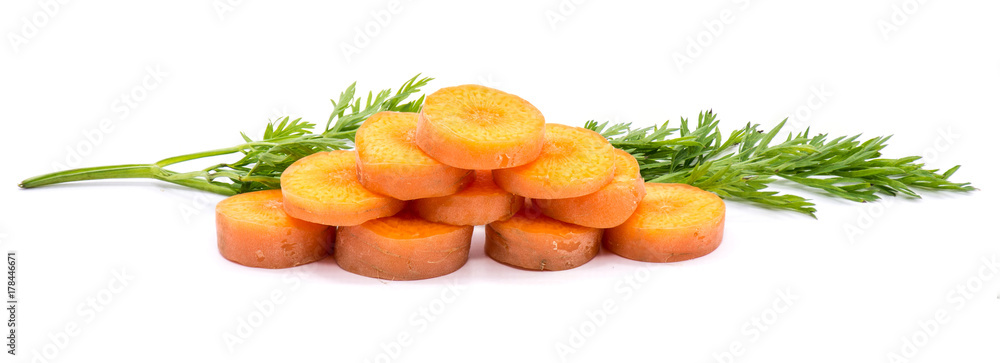 Group of sliced round orange carrot circles in the shape of pyramid with fresh green leaf isolated on white background Group of sliced round orange carrot circles in the shape of pyramid with fresh green leaf isolated on white background