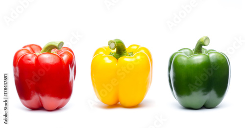 three colors of sweet bell pepper on white background ( Capsicum annuum., SOLANACEAE )
