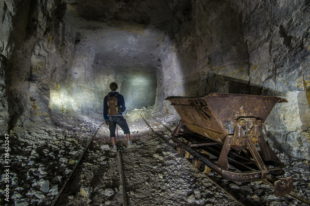 Miner at old wooden timbering in an abandoned limestone mine in Sock, Samara Region