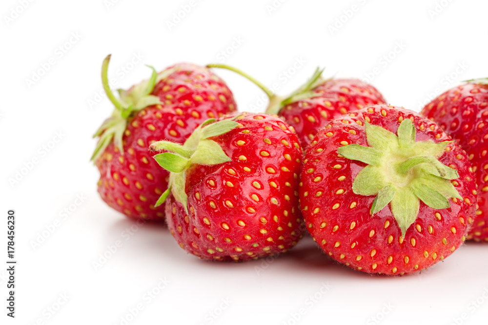many berries ripe juicy strawberries on a white table many berries ripe juicy strawberries on a white table