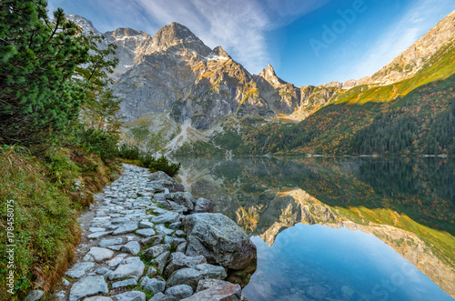 Fototapeta Naklejka Na Ścianę i Meble -  Tatra mountains, footpath and Morskie Oko lake, fall morning, Poland