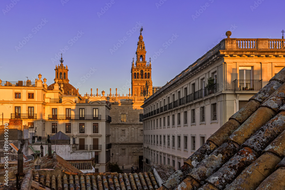 Beautiful Gothic building of the Cathedral of Saint Mary of the See (Seville Cathedral) on sunset. Seville (Sevilla), Andalusia, Southern Spain.