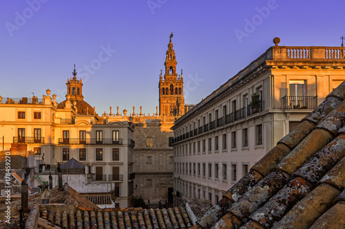 Beautiful Gothic building of the Cathedral of Saint Mary of the See (Seville Cathedral) on sunset. Seville (Sevilla), Andalusia, Southern Spain.