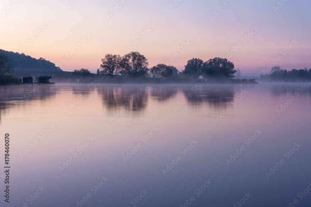 French countryside - Lorraine. A small lake with fisherman's hut at sunrise.