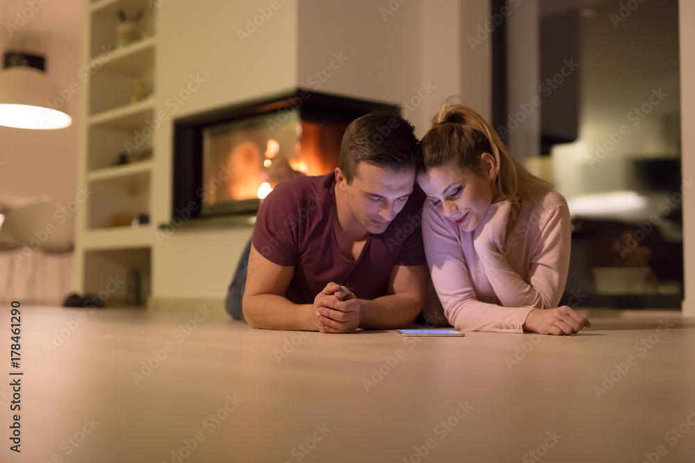 Young Couple using digital tablet on cold winter night Young Couple using digital tablet on cold winter night