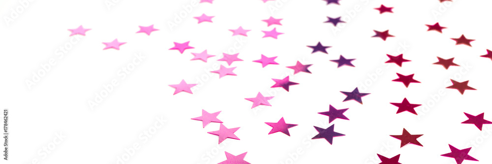 Colorful shiny stars on a white background, copy space Colorful shiny stars on a white background, copy space