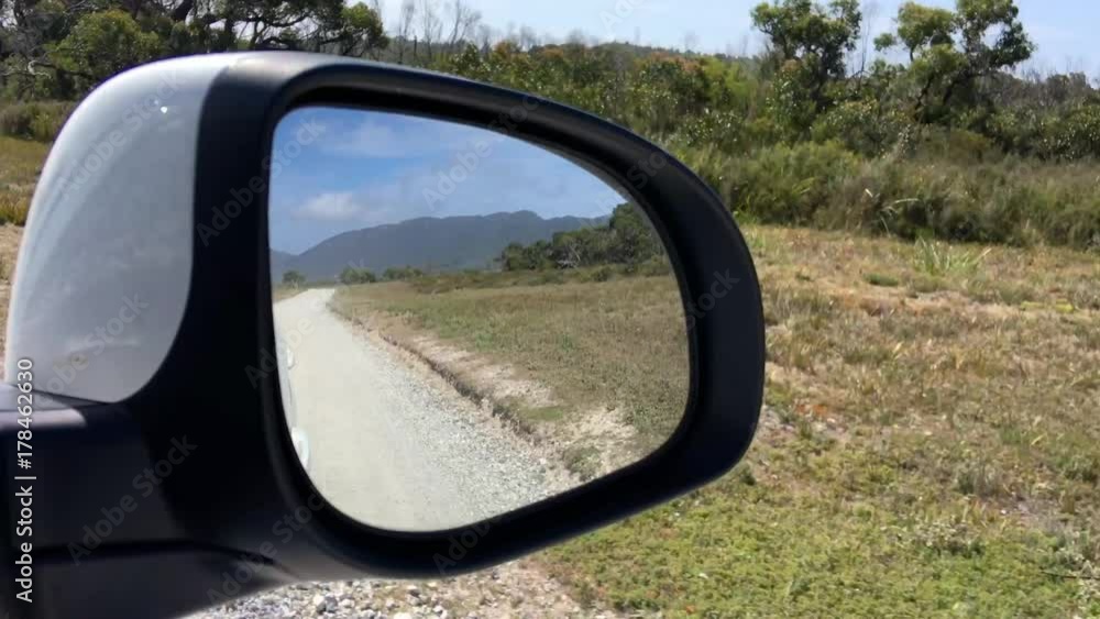 Along the road in Victoria, Australia. View from car mirror. Along the road in Victoria, Australia. View from car mirror.