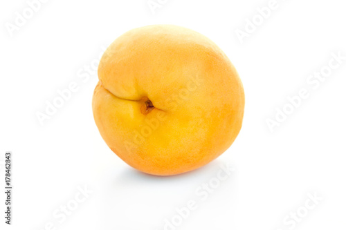ripe juicy yellow apricot on white table