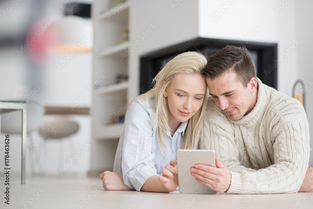 Young Couple using digital tablet on cold winter day Young Couple using digital tablet on cold winter day