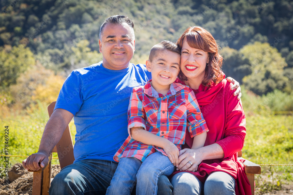 Mixed Race Caucasian and Hispanic Family At The Park. Mixed Race Caucasian and Hispanic Family At The Park.