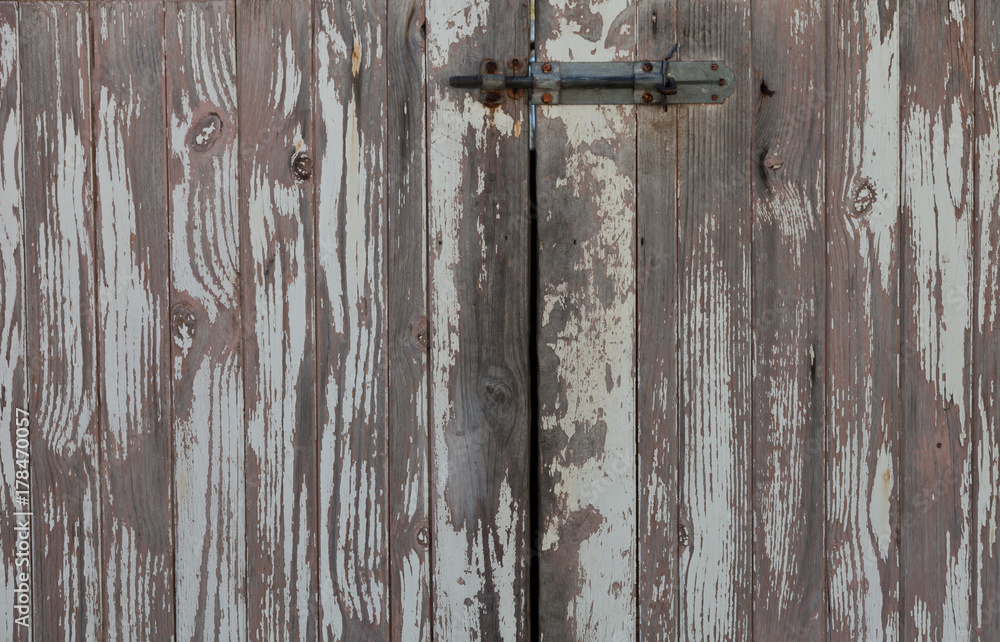 Closeup of weathered  rustic doors in subtle greys