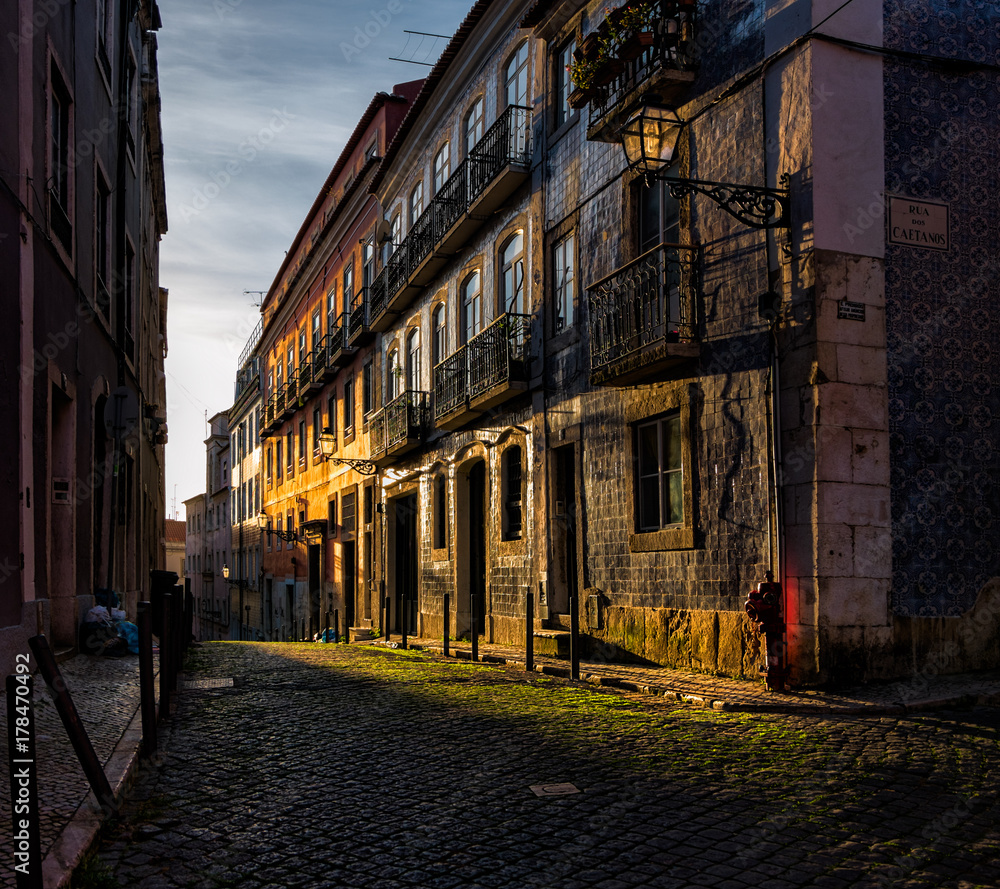Shadows and sunset on the streets of old Lisbon. Portugal.