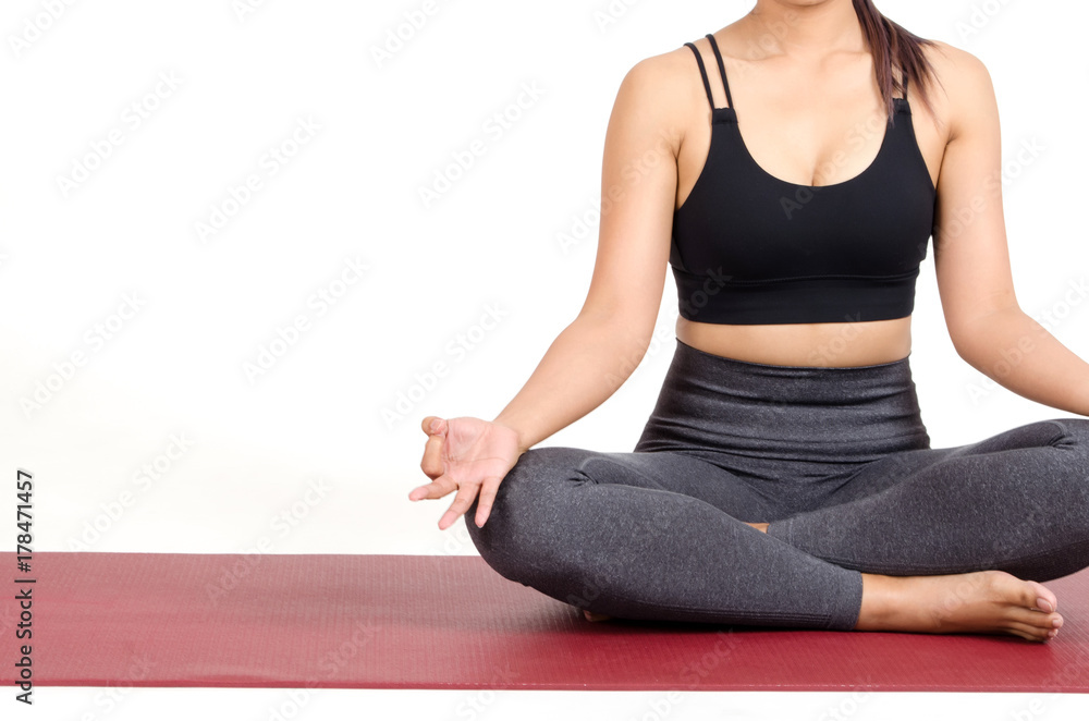 front view of young asian woman doing yoga in Padmasana or Lotus yoga pose on the mat isolated on white background, exercise fitness, sport training, healthy lifestyle concept front view of young asian woman doing yoga in Padmasana or Lotus yoga pose on the mat isolated on white background, exercise fitness, sport training, healthy lifestyle concept